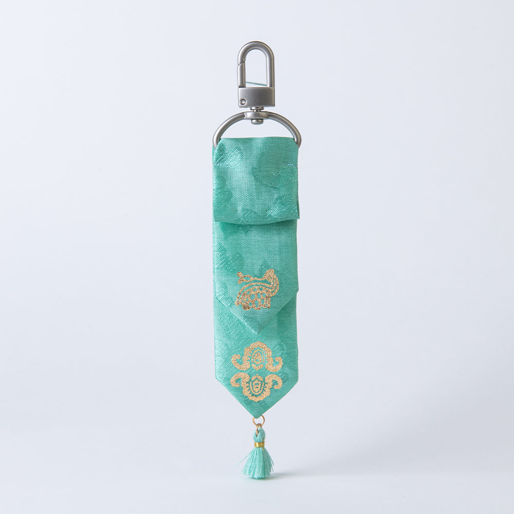 Handcrafted Korean silk keyring with gold-leaf emblem of turtle and bat by GLEAF – 100% silk handmade accessory