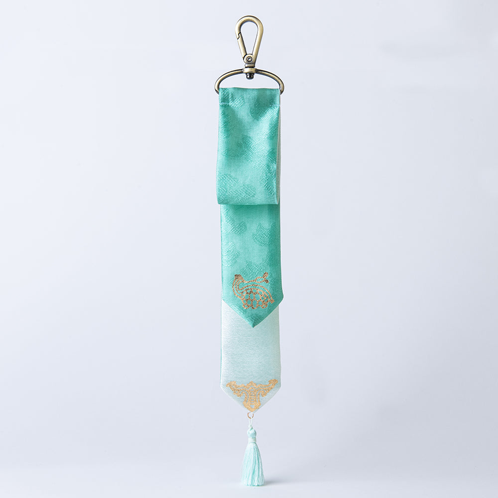 Handcrafted Korean silk keyring with gold-leaf emblem of turtle and bat by GLEAF – 100% silk handmade accessory