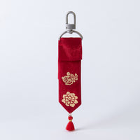 Handcrafted Korean silk keyring with gold-leaf emblem of money symbol and peony by GLEAF – red 100% silk handmade accessory